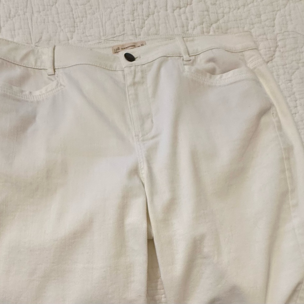 White straight jeans, can be cuffed or left straight.